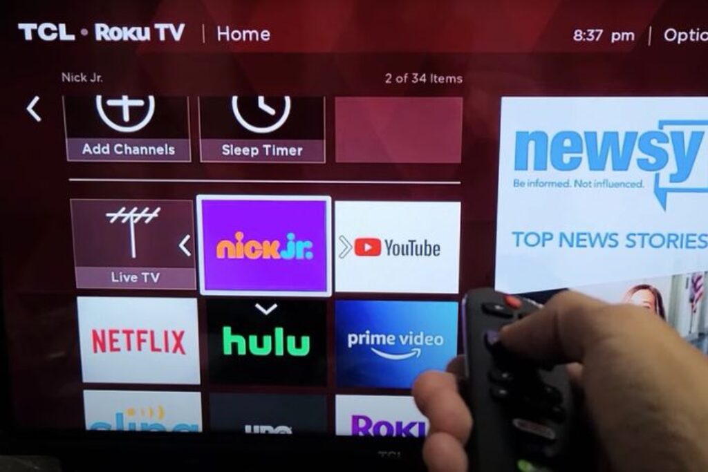 Person adjusting App on roku 